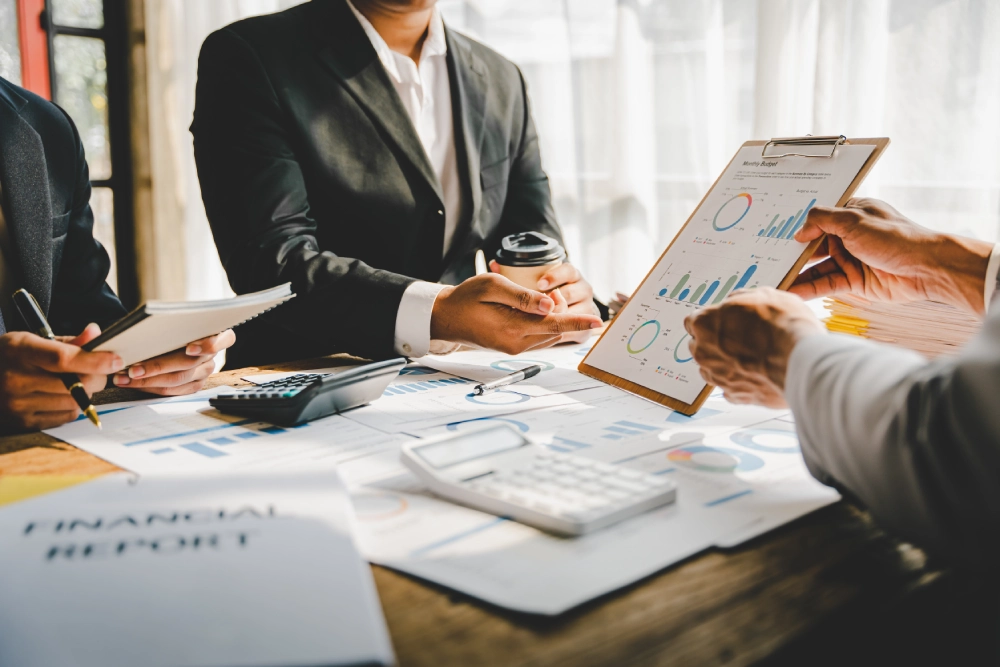 Home affluence mgt young colleagues discuss business and analytical img